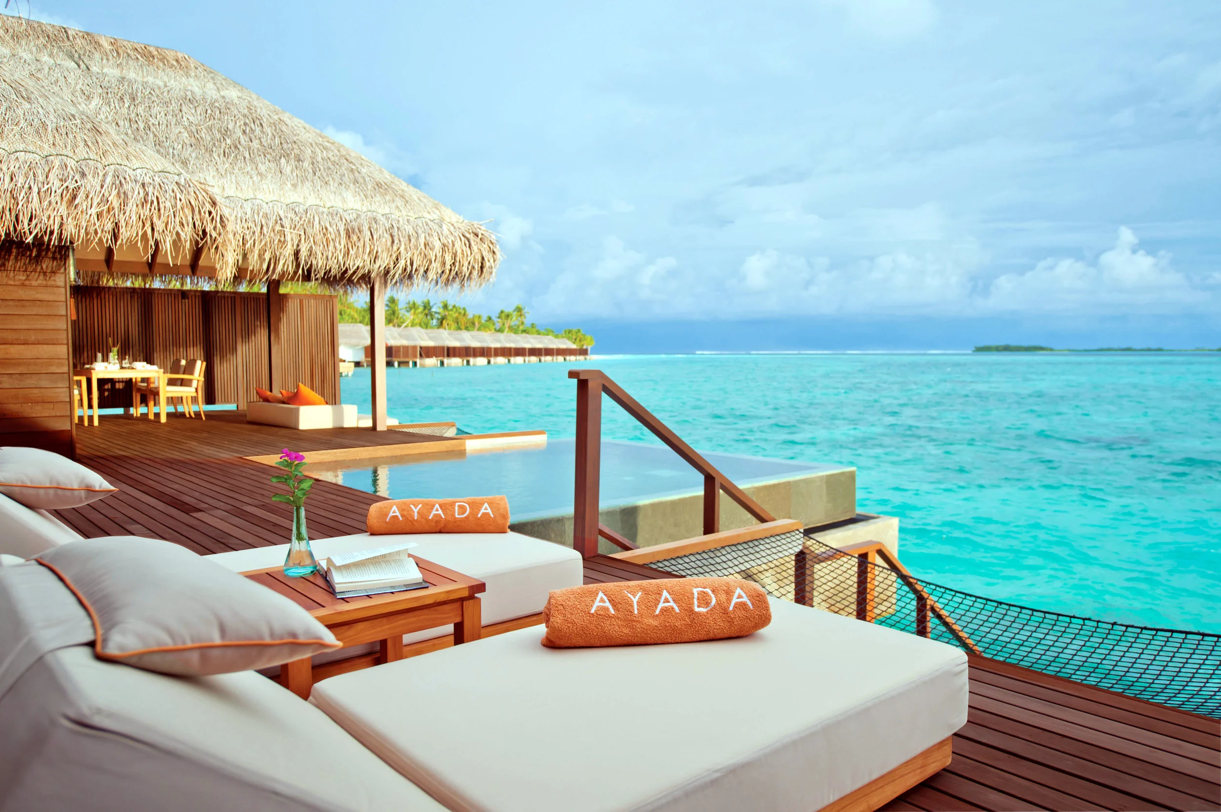Sunset Family Ocean Suite with Pool · Two bedrooms · over-water sunset